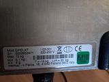 a close up of a metal object with a barcode on it