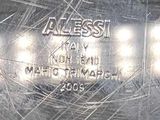 a close up of a silver plate with a name on it