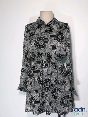 a black and white shirt dress with a black and white pattern