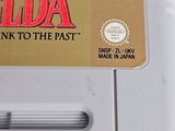 an old nintendo game console with the legend of zelda back to the past sticker