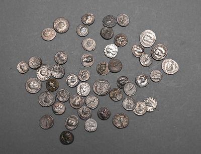 a pile of silver coins on a table