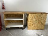 two wooden cabinets with shelves on them in a room