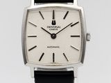 a close up of a wrist watch with a black leather strap