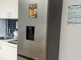 an image of a modern kitchen with stainless steel appliances