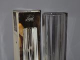 a glass vase and a box on a table
