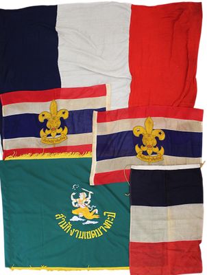 four different colored flags with gold and red and blue and white