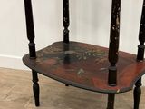 a black and red table with two candles on it