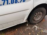 a white van with a blue decal on the side of it
