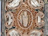 an old metal box with carvings of birds and flowers on it