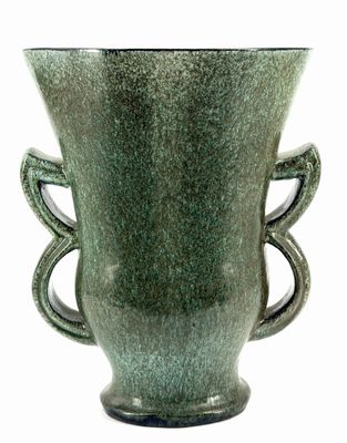 a green vase with two handles on a white background