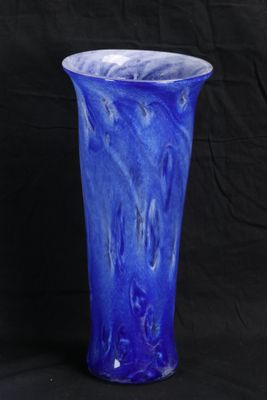 a blue vase that is sitting on a black background
