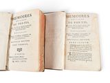 an old book opened to show the pages of a poem