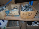 two boxes that have wires in them on a shelf