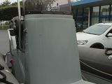 a boat that is sitting in the parking lot