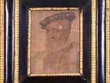 portrait d'un homme portant un chapeau et une moustache, dans un cadre noir