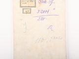 an old envelope with a stamp on it sitting on top of a table