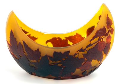 a yellow and brown bowl with leaves on it