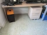 a computer desk with two monitors and a keyboard on it
