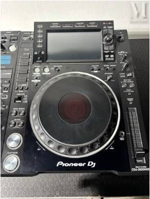 a cd player that is sitting on top of a table