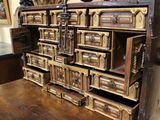 a large wooden chest with many drawers on it