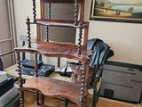 hardwood flooring in a living room with a couch, chair, and bookcase