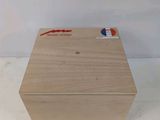 an image of a wooden box with a red arrow on it