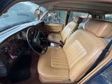 a picture of the inside of a car with leather seats