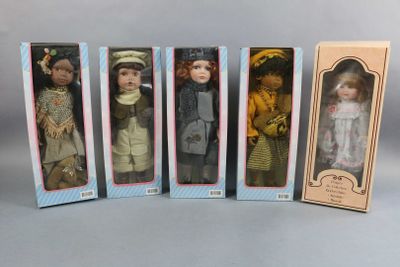 six boxed dolls of different sizes and colors are lined up in a row