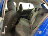 a blue car that is sitting in the back of the car