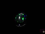 a close up of a glowing orb in the dark with a black background
