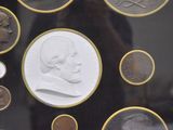 a picture of a picture of a man with a coin