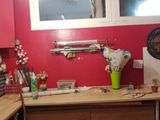 a picture of a kitchen with red walls and a window