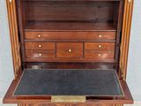 an antique wooden dresser with a marble top and drawers