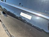 a close up of a car door with a sticker on it