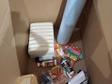 a cardboard box filled with many different types of items