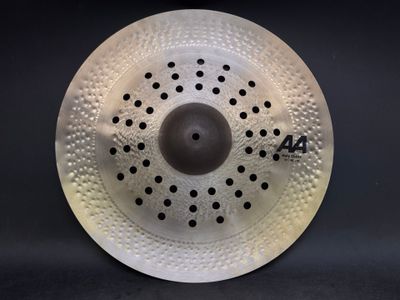 a close up of a white drum on a black background