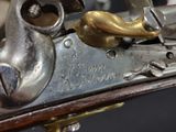 a close up of a gun on display in a museum