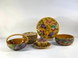 a lot of plates and bowls that are sitting on a table
