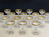 a lot of glasses that are sitting on a table