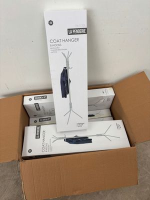 a cardboard box with a coat hanger on top of it