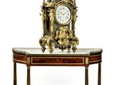a small table with a clock on top of it
