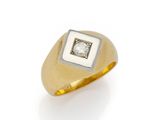 a gold and diamond signet ring
