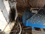 an image of a room with a blue tank and a blue chair