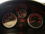a close up of a car dashboard with various gauges