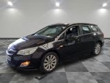 a picture of a black car parked in a showroom