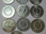a close up of a bunch of coins sitting on top of a table