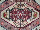 an oriental rug with a red, green, and blue design