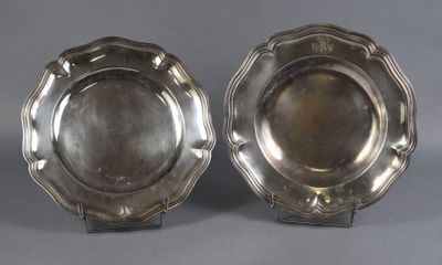 a pair of silver plated dishes on stands