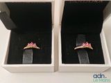 two rings in a box that are sitting on top of each other