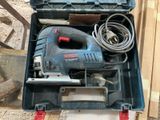 a tool in the case that is sitting on the floor